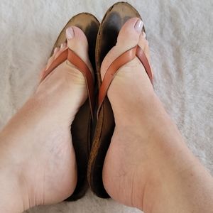 Well worn sandals flat flip flops shoes used